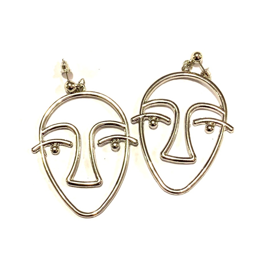Artistic and unique metal face earrings!